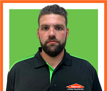 Raffaele, male, SERVPRO employee, cut out, against a white background, SERVPRO green sign above head